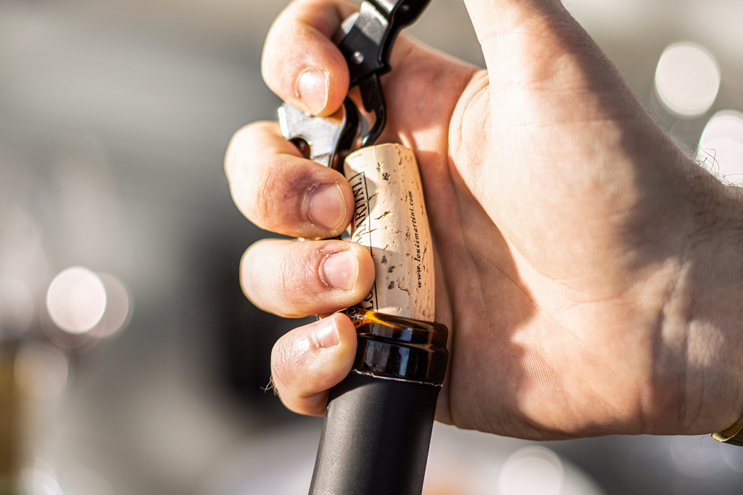 wine bottle being uncorked