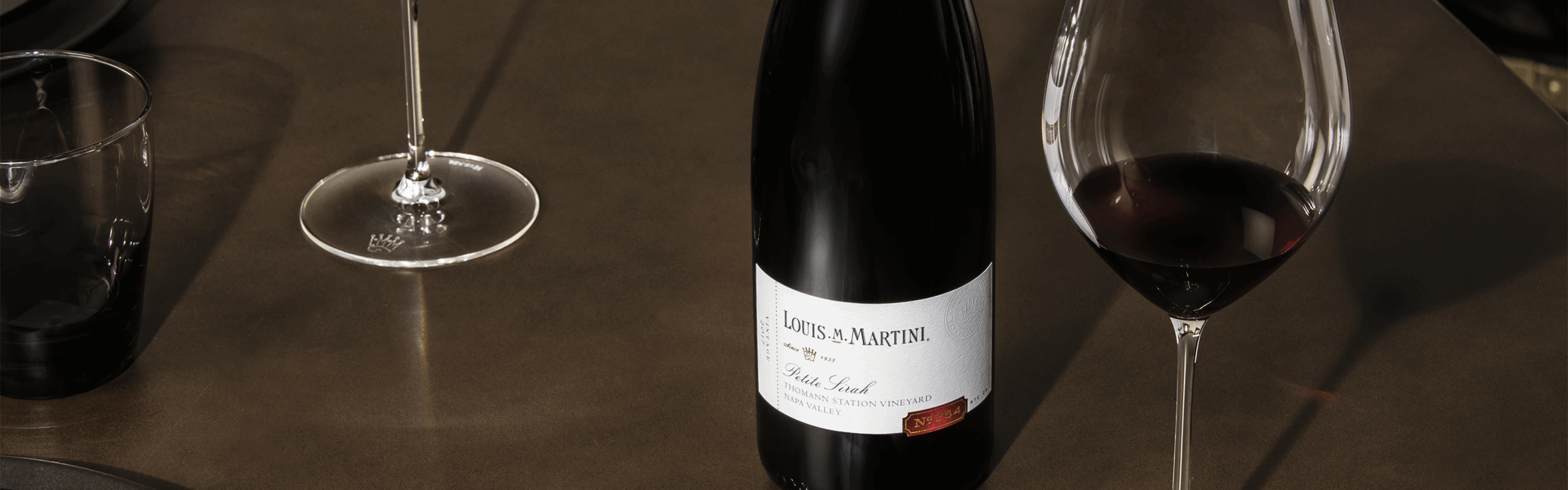 wine bottle on table with wine glasses