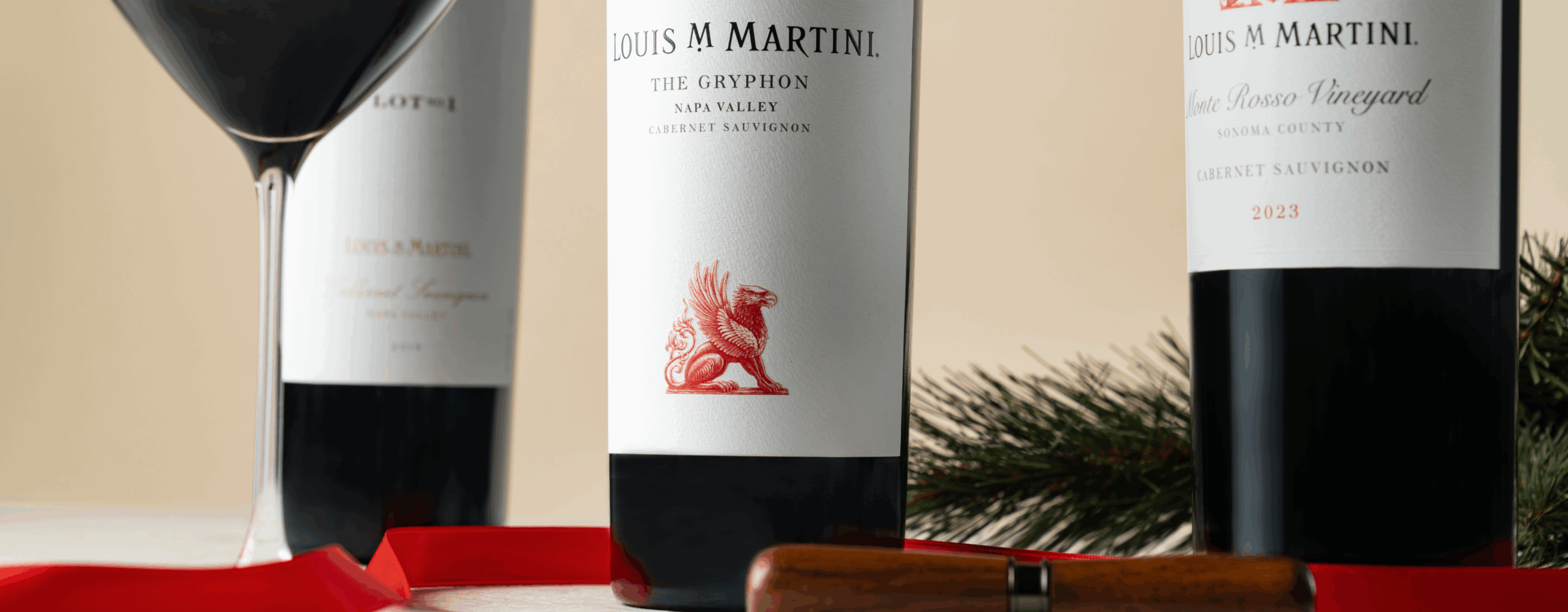 The Gryphon Cabernet Sauvignon bottles and wine glass