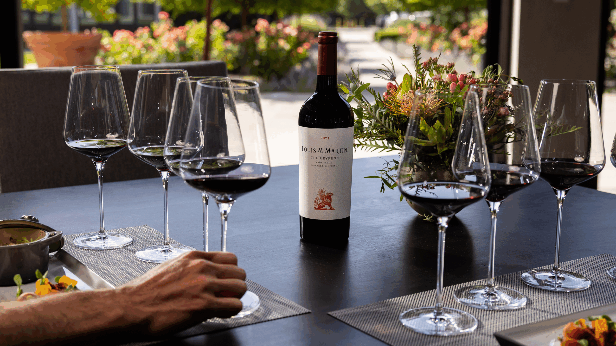 seated wine tasting - hand grabbing wine glass