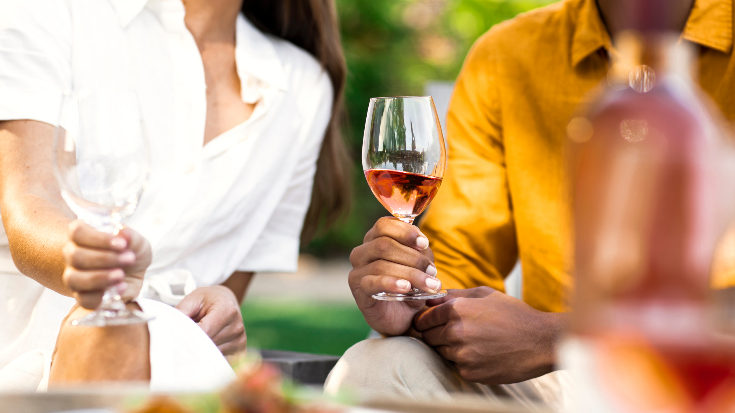 people holding wine glasses