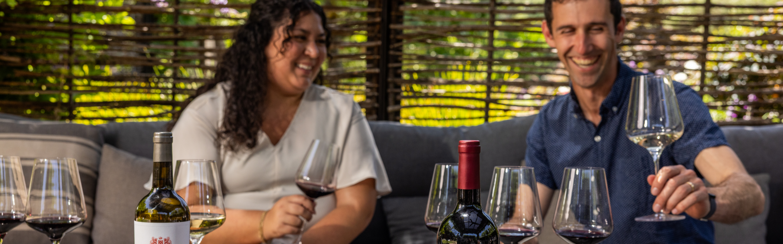 people wine tasting outside at louis m. martini winery