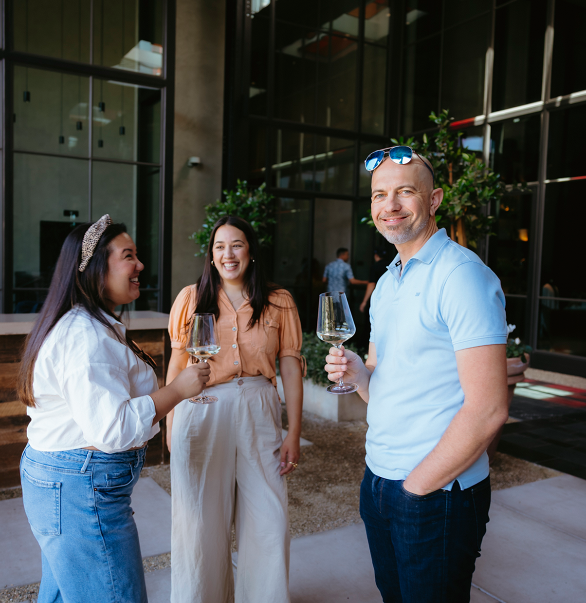 people enjoying wine at louis m. martini winery entrance