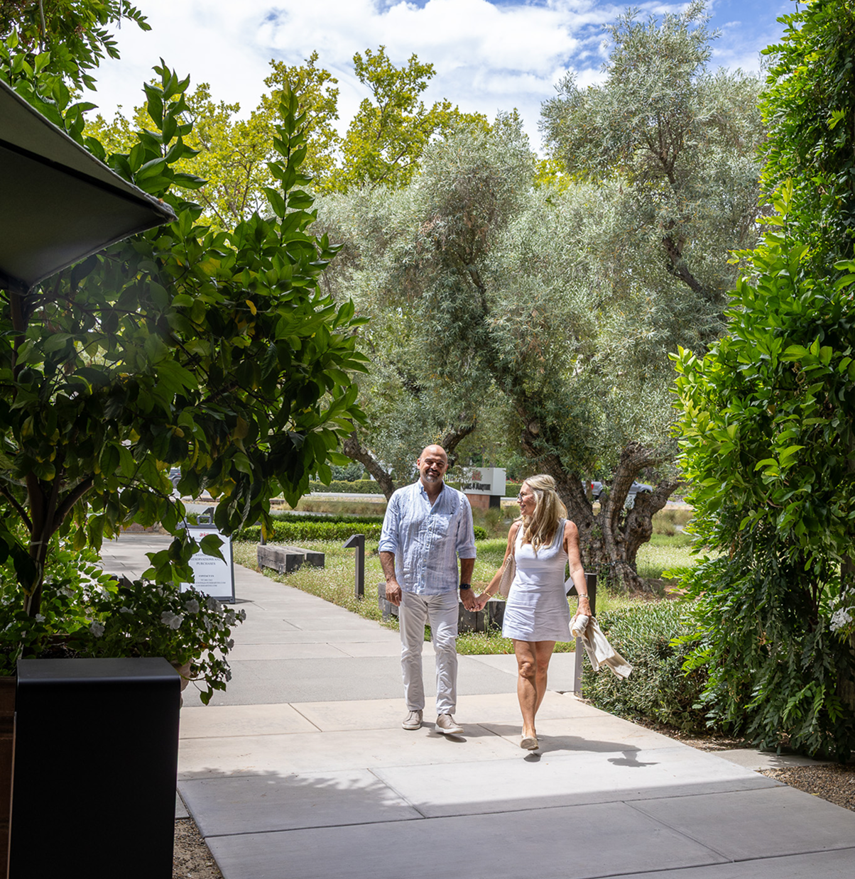 couple walking into Louis m. martini winery